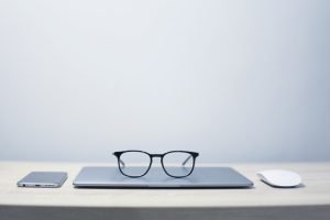 glasses, notebook, phone