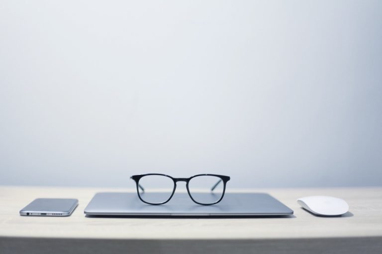 glasses, notebook, phone